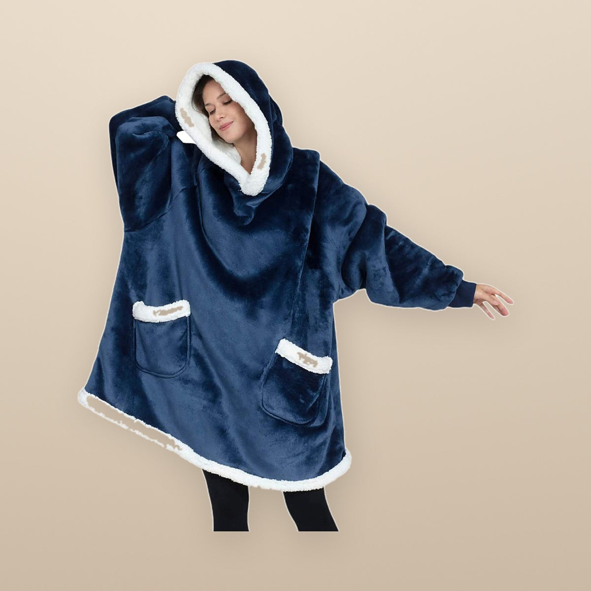 The Burrow oversized hoodie blanket in dark blue, showing the sherpa trim on the hood and front pockets